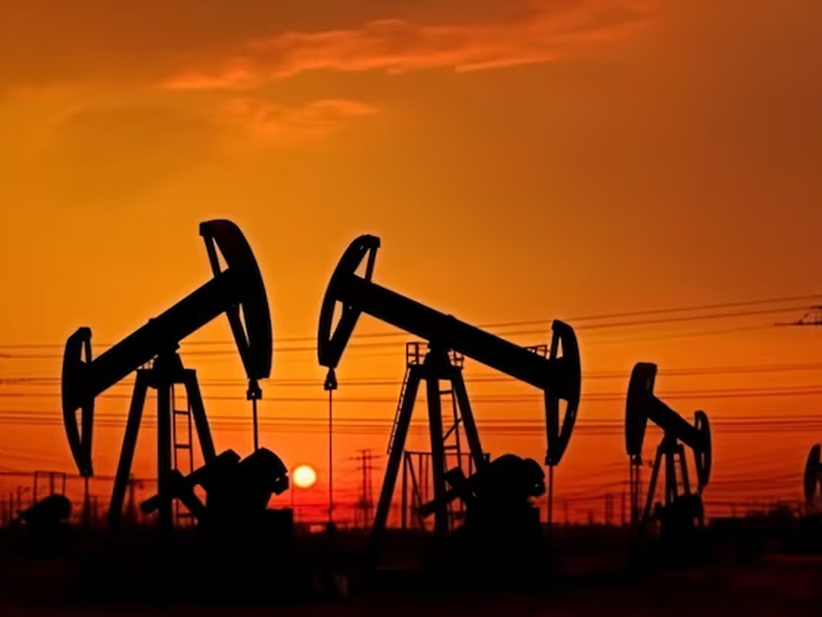 Oil production field at sunset